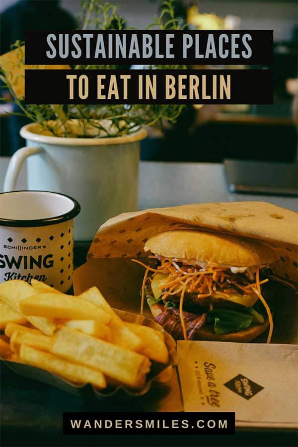 Photo of a vegan soy burger with fries at Swing Kitchen. Text overlaid SUSTAINABLE PLACES TO EAT IN BERLIN