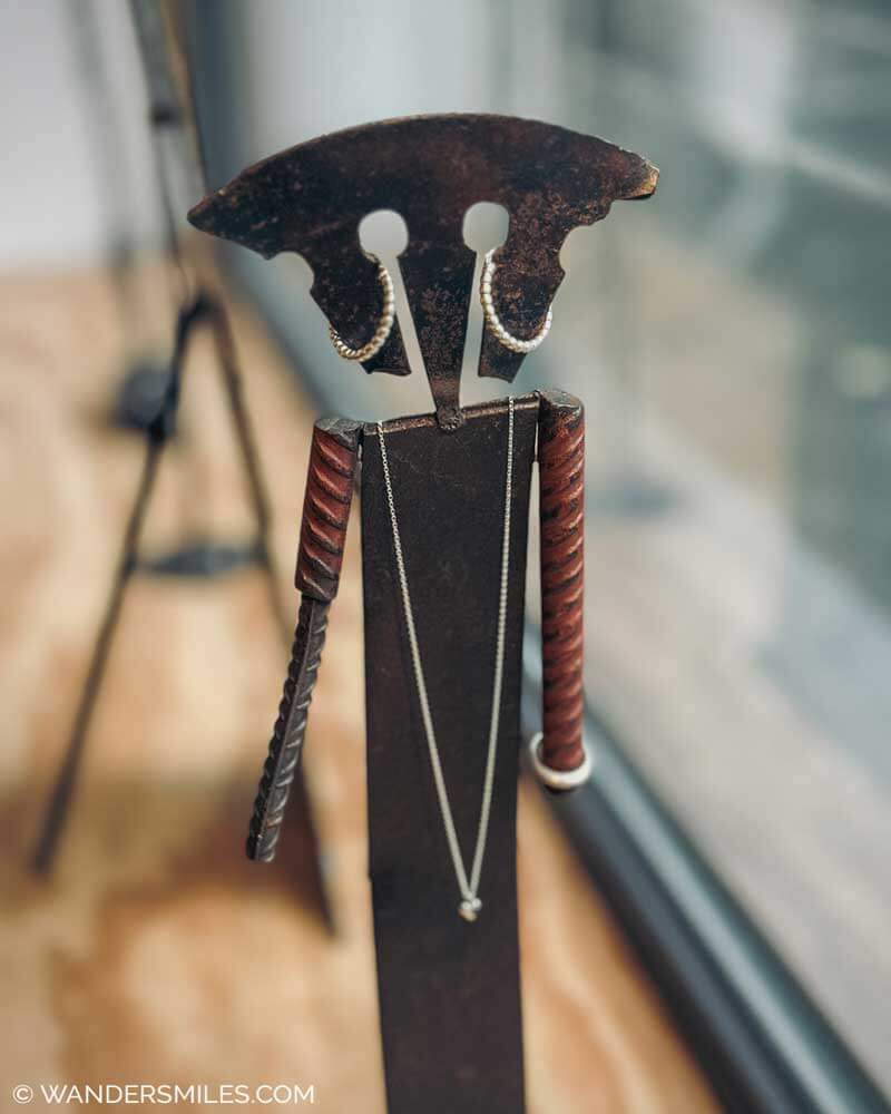 ERDEN Goldsmiths store in Dusseldorf. Photo shows jewellery draped on a metals figurine.