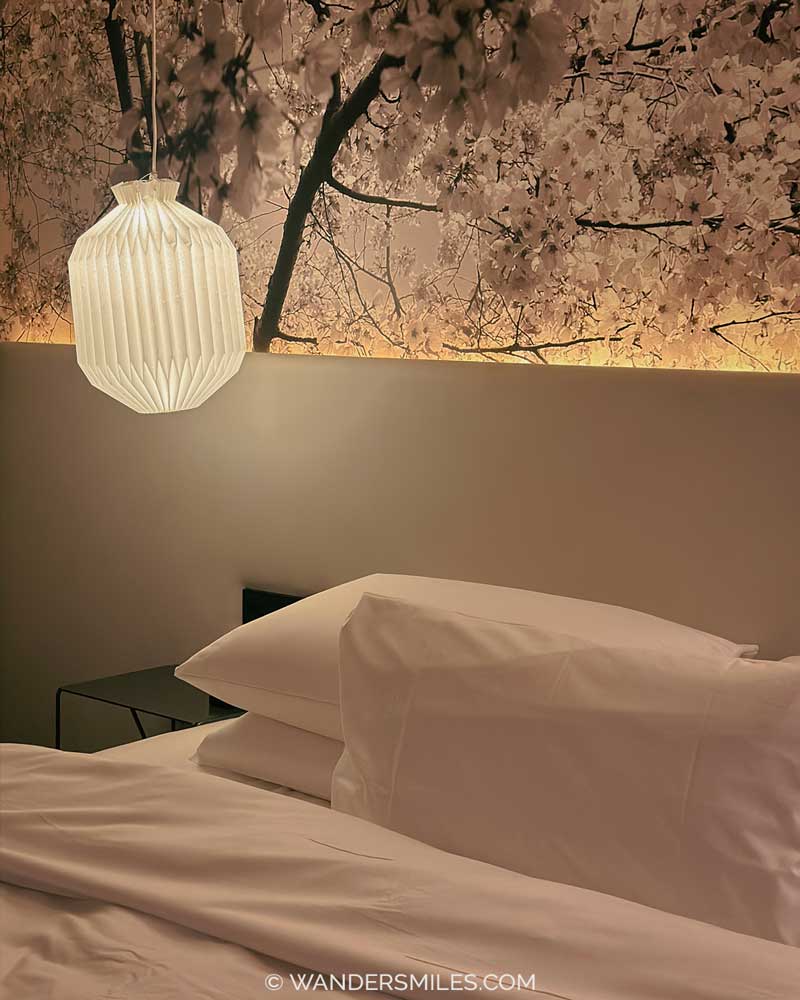 Bedroom with origami light and willow-style Japanese wallpaper in Me And All Hotels in Little Tokyo, Dusseldorf