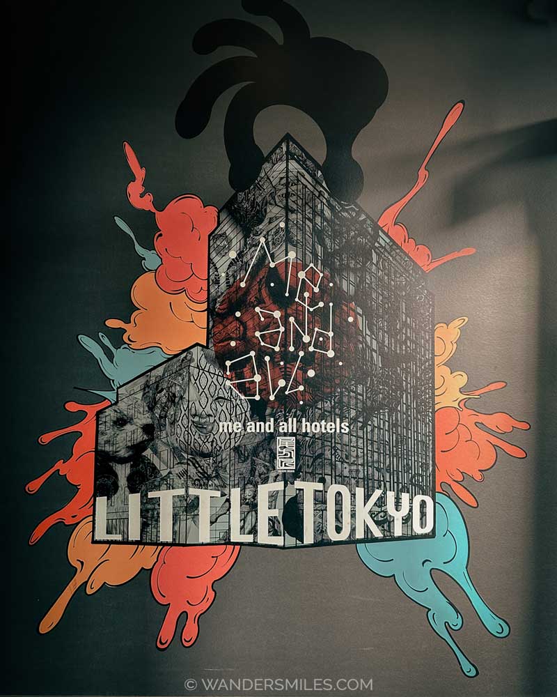 Graffitti-style mural at the entrance - with text Me And All Hotels in Little Tokyo, Dusseldorf