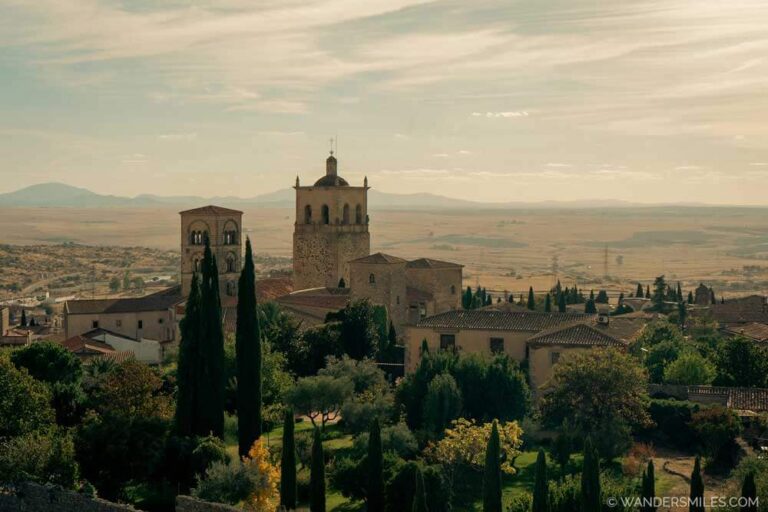 Take in the views from Trujillo Alcazaba when visit Extremadura with medieval buildings and golden glow in the sky