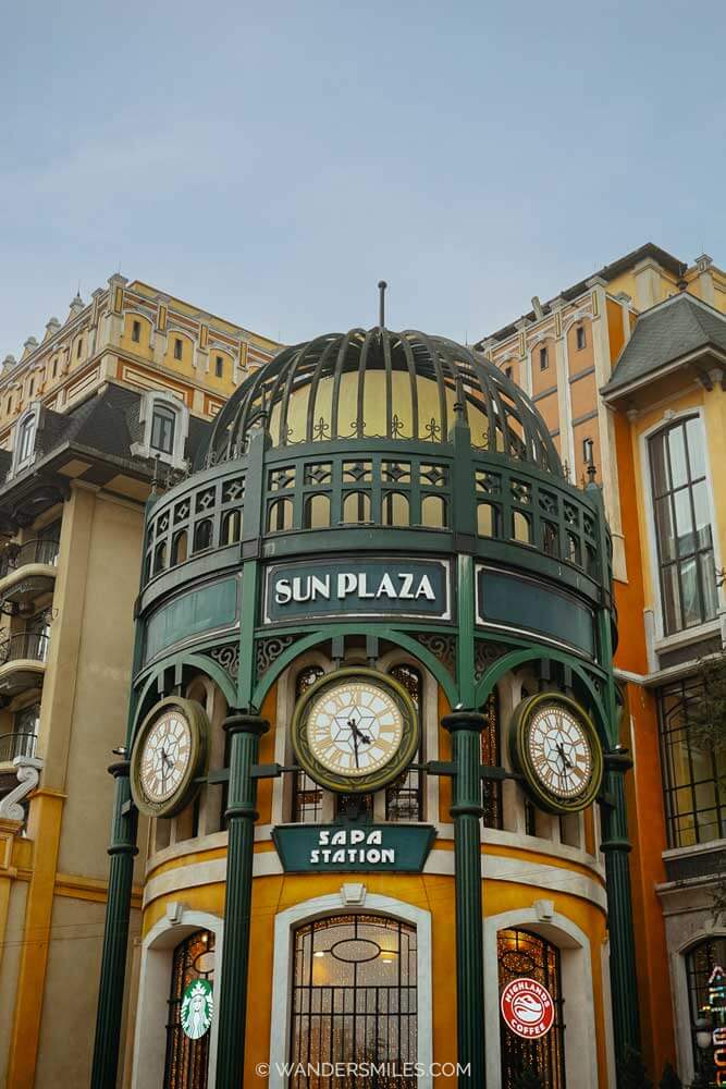 Entrance to Sun Plaza for Fansipan Peak, with signage for Starbucks and Highlands Coffee