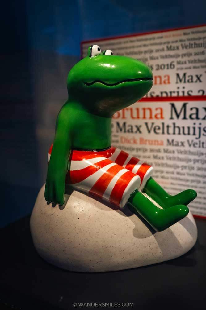 This photo shows a small frog sitting on a rock displayed in Museum Centraal, Utrecht. A character created by Dick Bruna as one of Miffy's friends