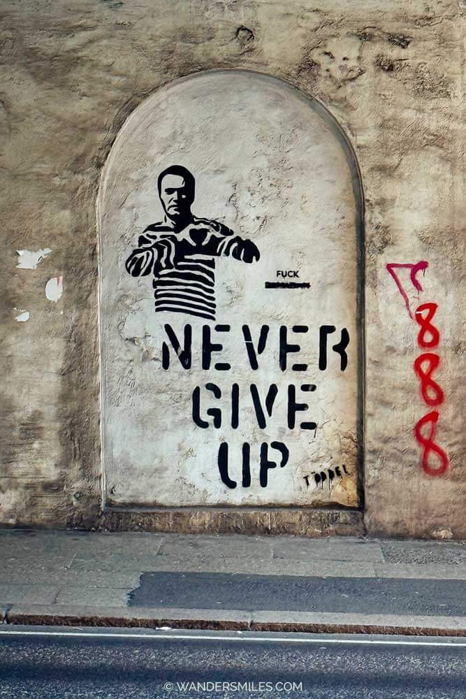 "Never Give Up" stencil street art by Norweigan street artist Töddel in B ergen