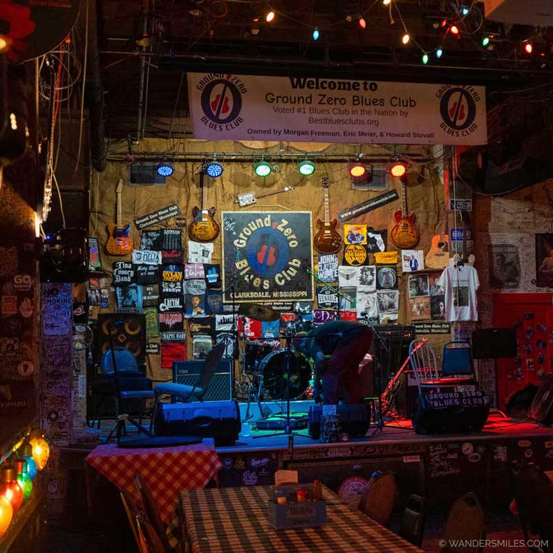 Stage inside the Ground Zero blues club, Clarksdale. with instruments and memorabilia on the wall.