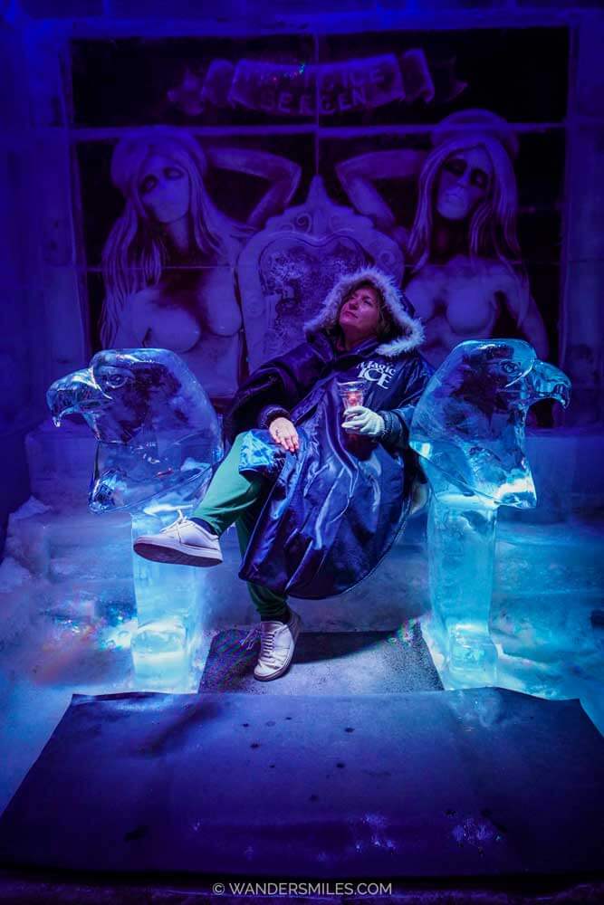 A woman in a chair in Magic Ice Bergen – an ice-art gallery and bar