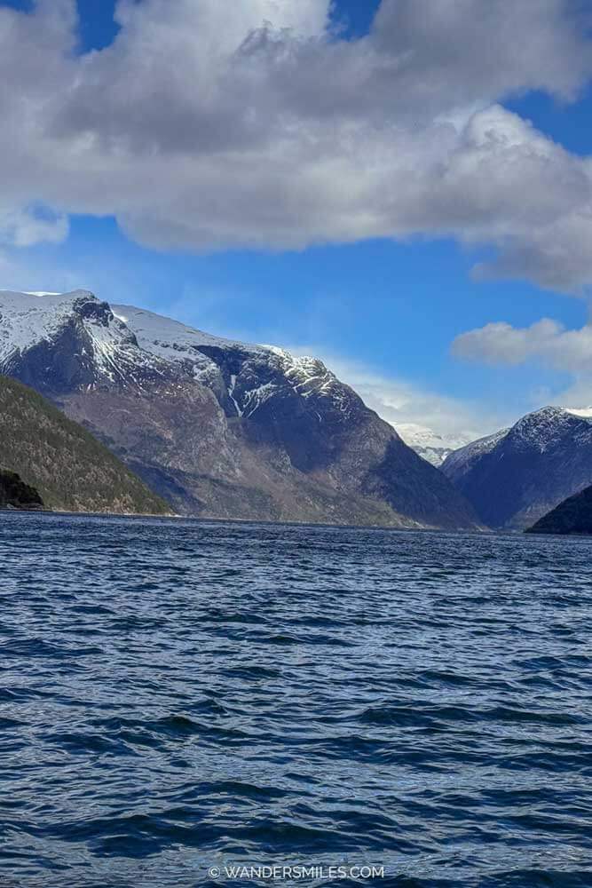 Hardangerfjord views of snow-capped mountains towering over the water whilst on a RIB boat safari