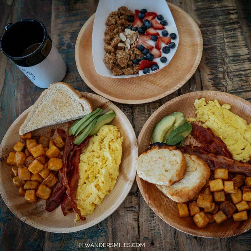 Breakfast in Yazoo Pass – one bowl of granola and berries - 2 plates of egg, avocado, bacon and potatoes