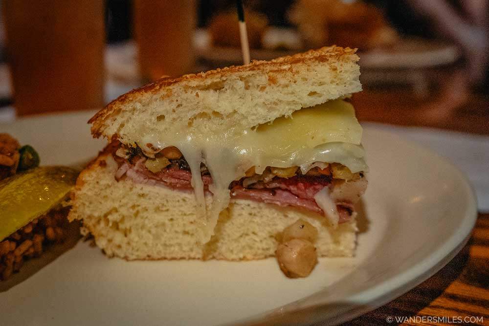 Muffuletta – A New Orleans-Sicilian-inspired sandwich with cured meats (ham and salami), provolone cheese, olive dressing and great bread