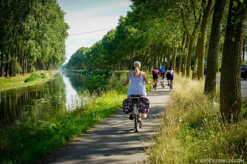 Cyclists along the Damse Vaart from Bruges to Damme
