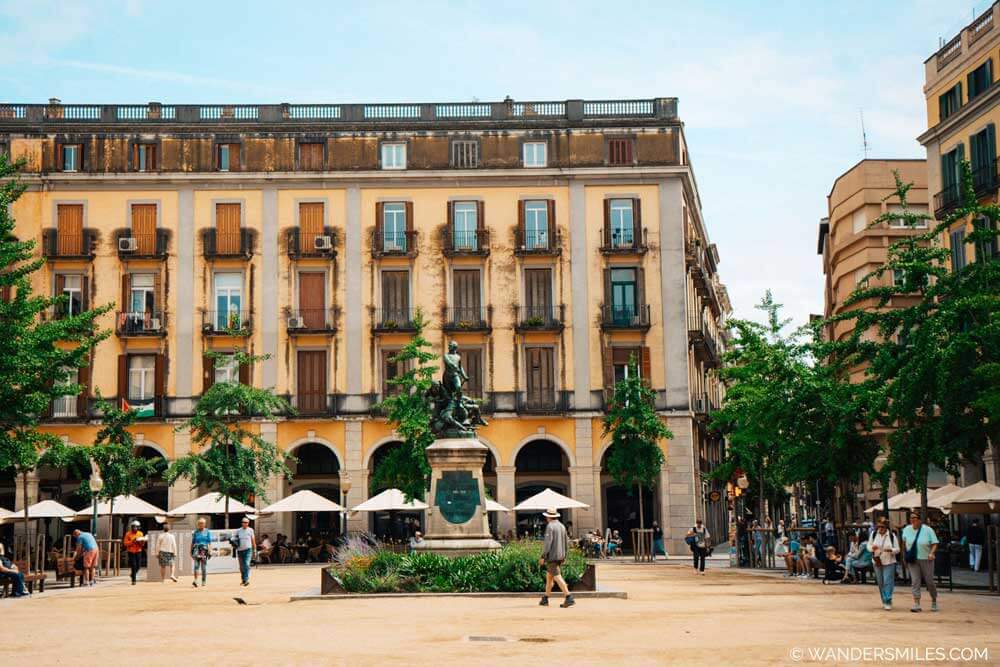 Plaza de la Independencia, in Girona, with 19th-century neoclassical architectural style buildings.