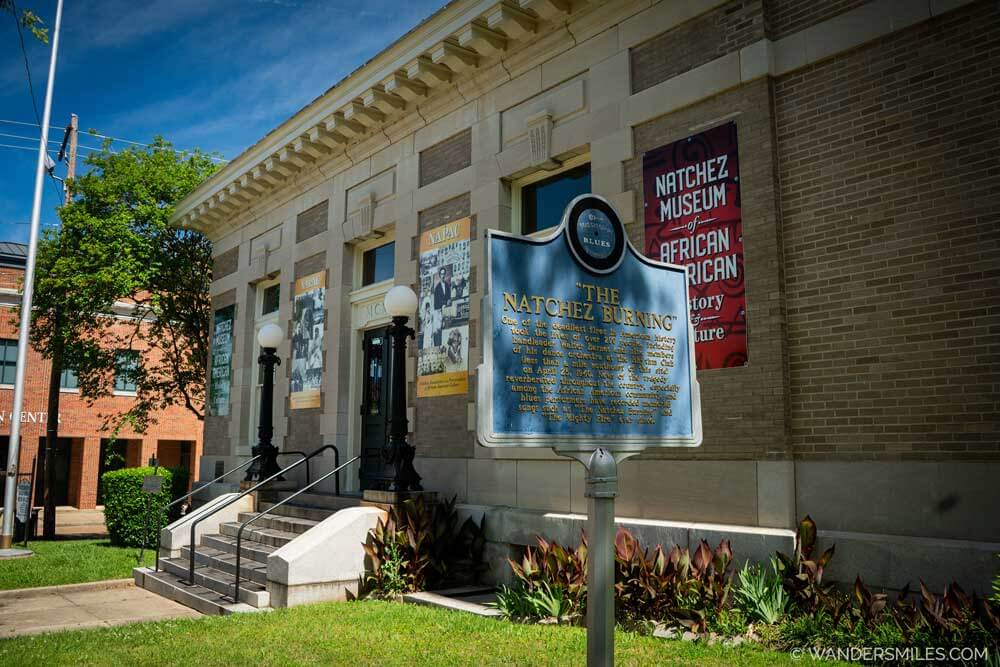 Exterior of the Natchez Museum of African American History and Culture, with the "Natchez Burning" Mississippi Blues Trail marker outside.