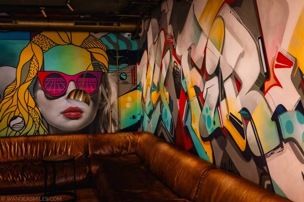 Graffitti-style mural with woman's face in the lobby of the Match Hotel in Eindhoven