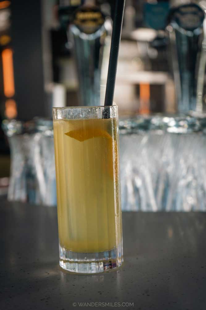 Yellowish-coloured New Dutch Cocktail on the bar in VANE Restaurant & Skybar in Eindhoven