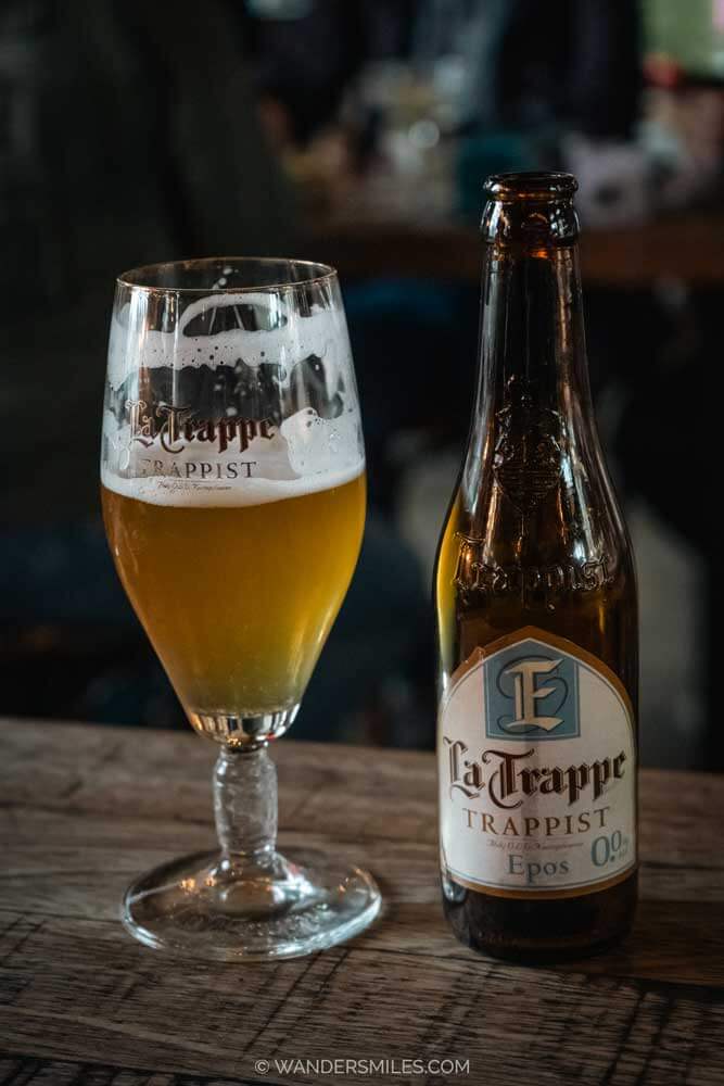 La Trappe bottle of beer with glass, in RAW, Tilburg