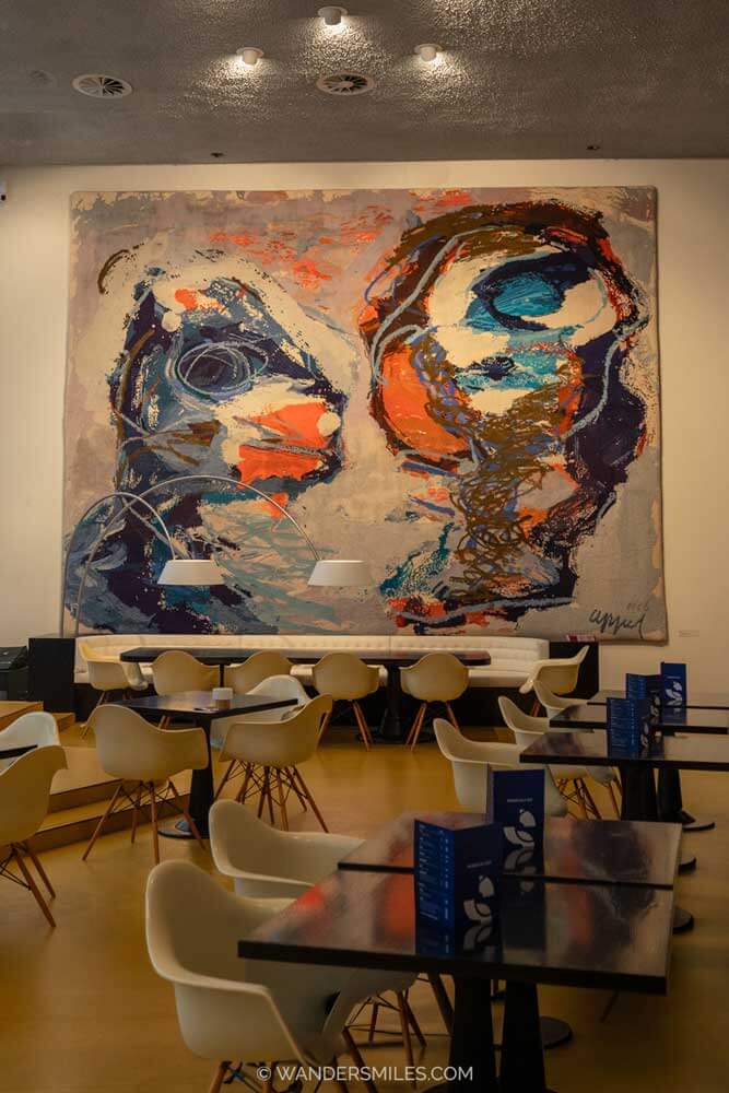 Tufted textile wall-hanging from painting "Two Personages" by Karel Appel, in Schouwburg Concertzaal Tilburg