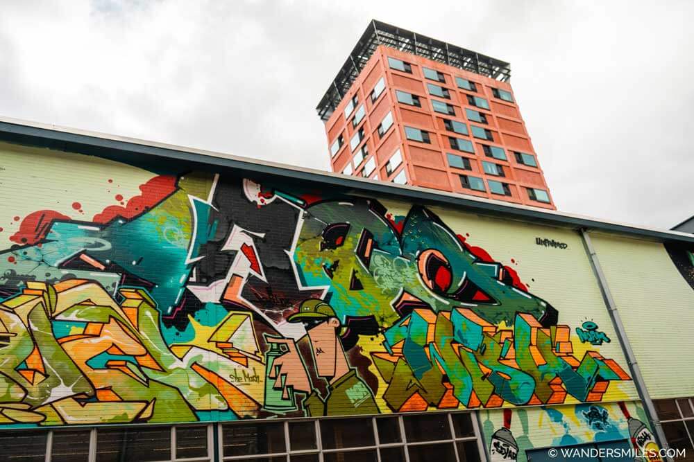 Haasje-Over in Strijp-S, Eindhoven. A high rise apartment block. And Skatepark with grafiiti exterior.