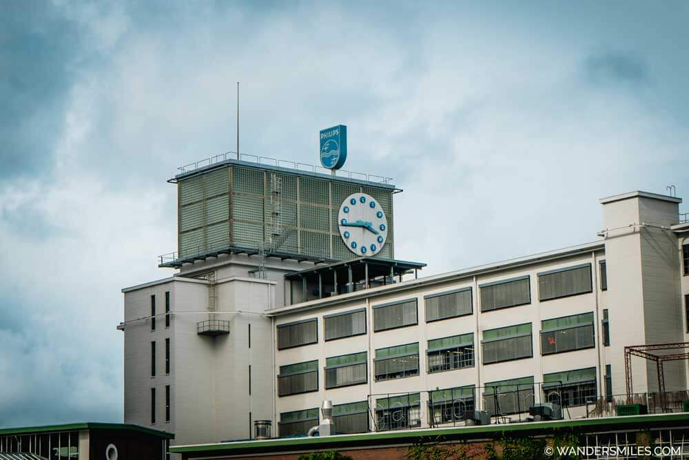 Klokgebouw in Strijp-S, Eindhoven: Industrial building with Philips logo and a clock.