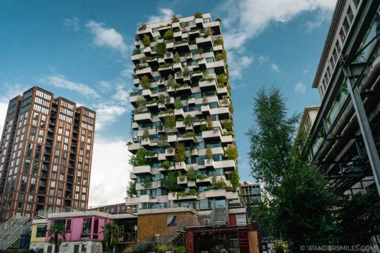 Trudo Tower in Strijp-S, Eindhoven. A high rise apartment block with greenery and trees and on the balconies. A fine example of New Dutch Design.