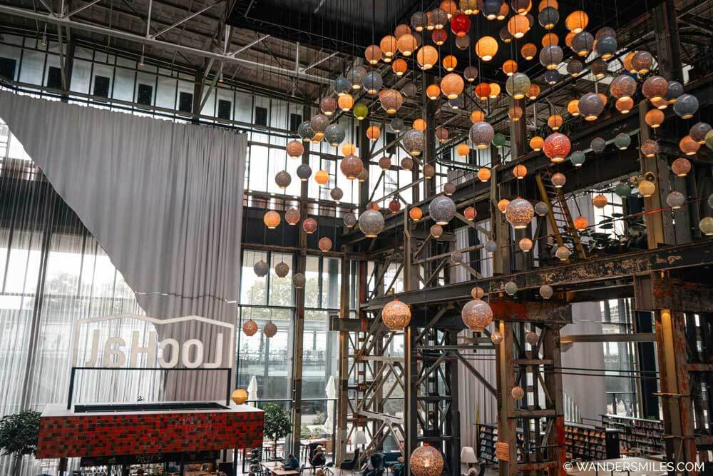 Inside of LocHal in Tilburg, an old locomotive warehhouse, now a library with upcycled interiors by local designers