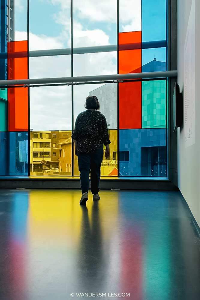 De Stijl-style window at the Van Abbemuseum in Eindhoven with silhouette of woman